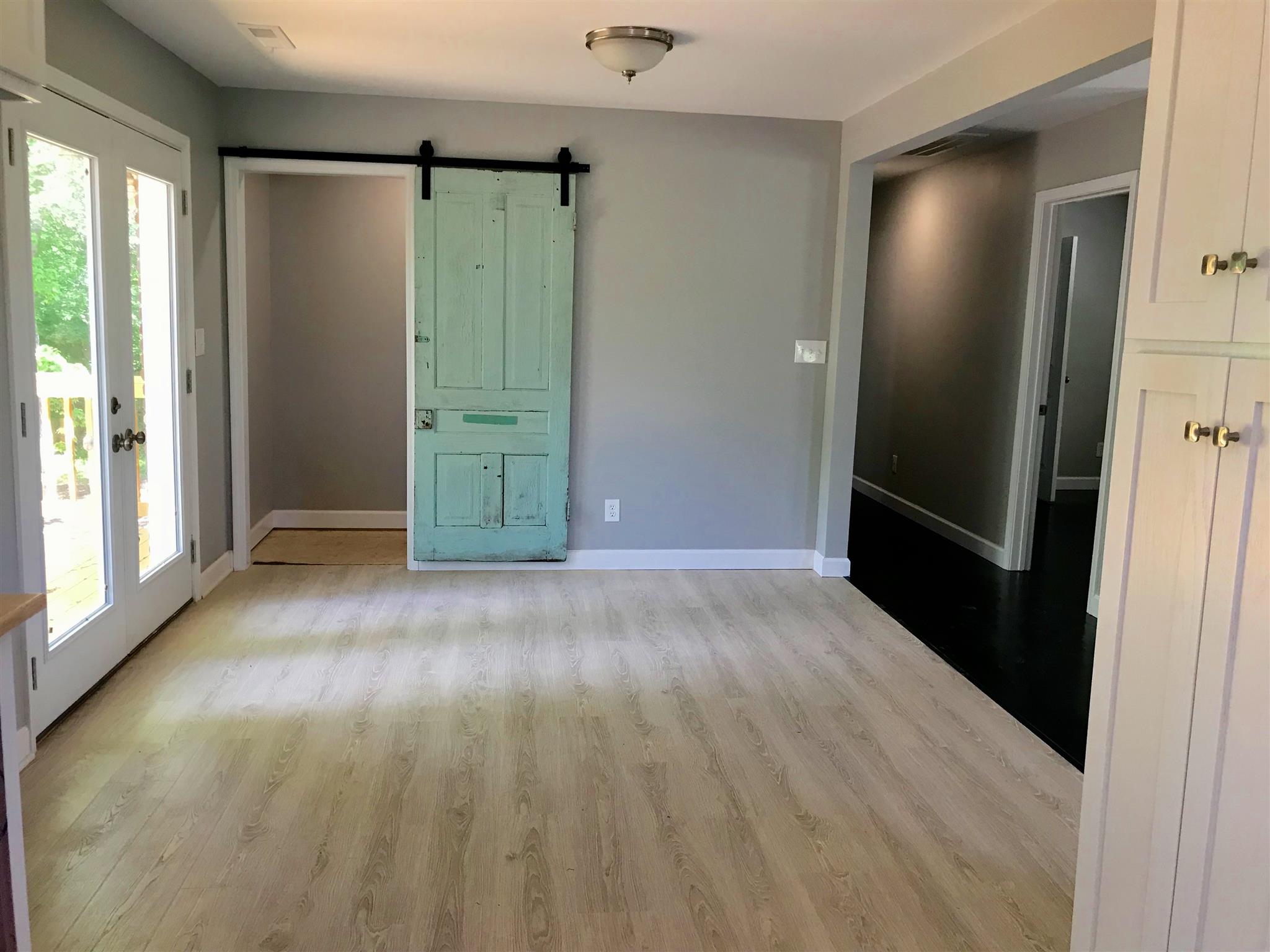1047 Salem Ridge Road Clarksville, TN 37040 - Photo 7 of 17 wooden floor in an empty room with a bathroom