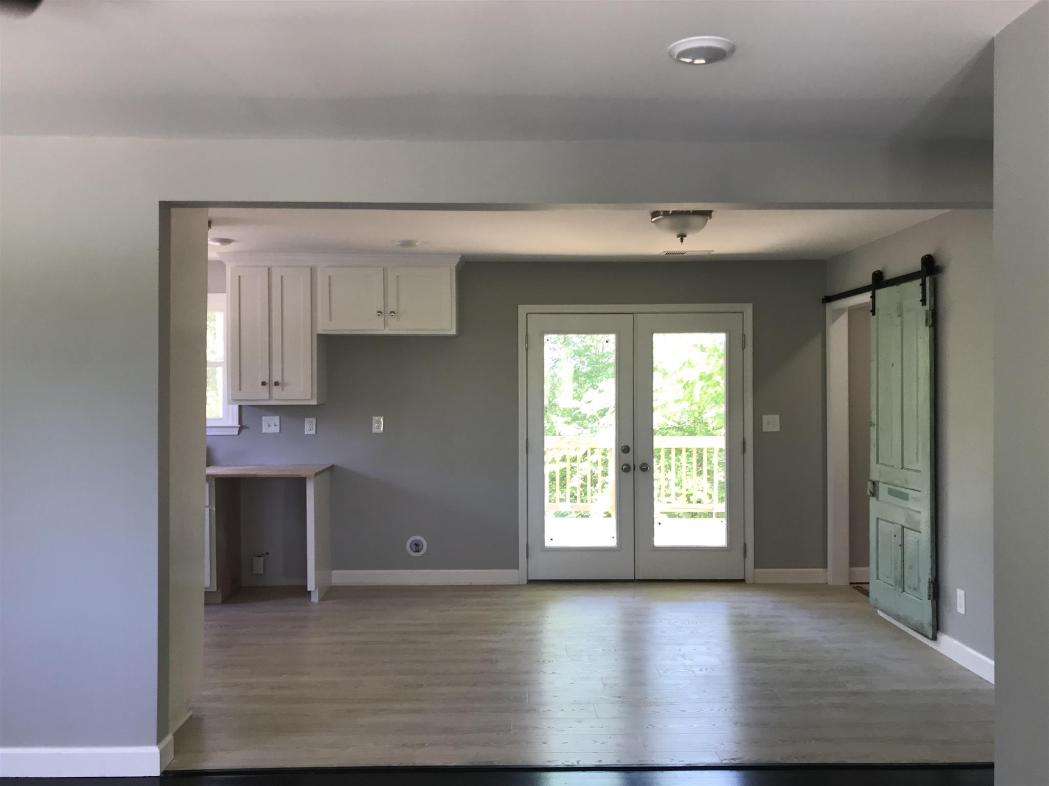 1047 Salem Ridge Road Clarksville, TN 37040 - Photo 10 of 17 an empty room with wooden floor and windows