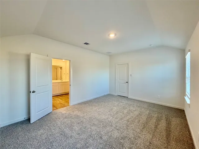 an empty room with a empty space and windows