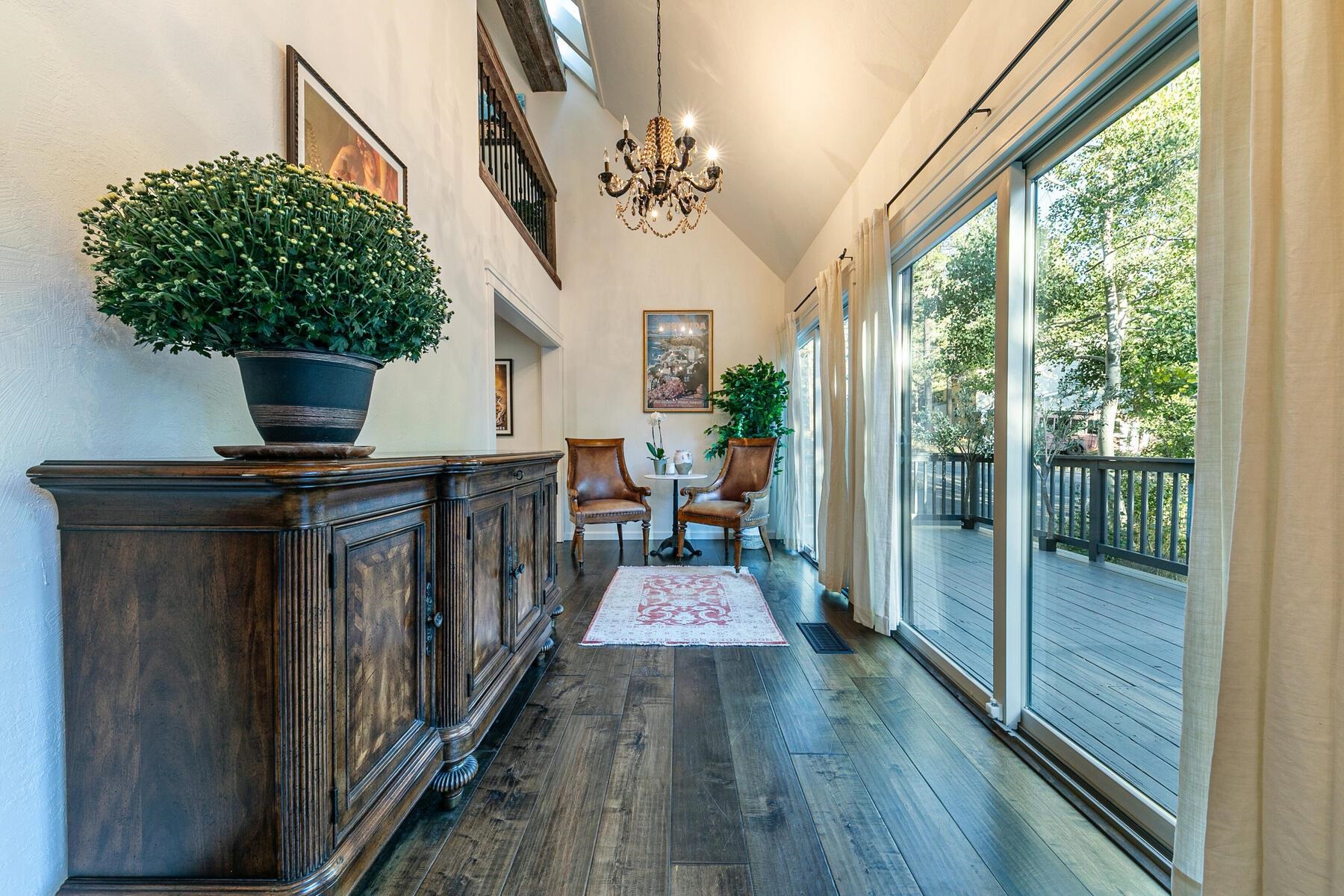 11568 Schussing Way Truckee, CA 96161 - Photo 12 of 28 a view of a hallway with wooden floor and staircase