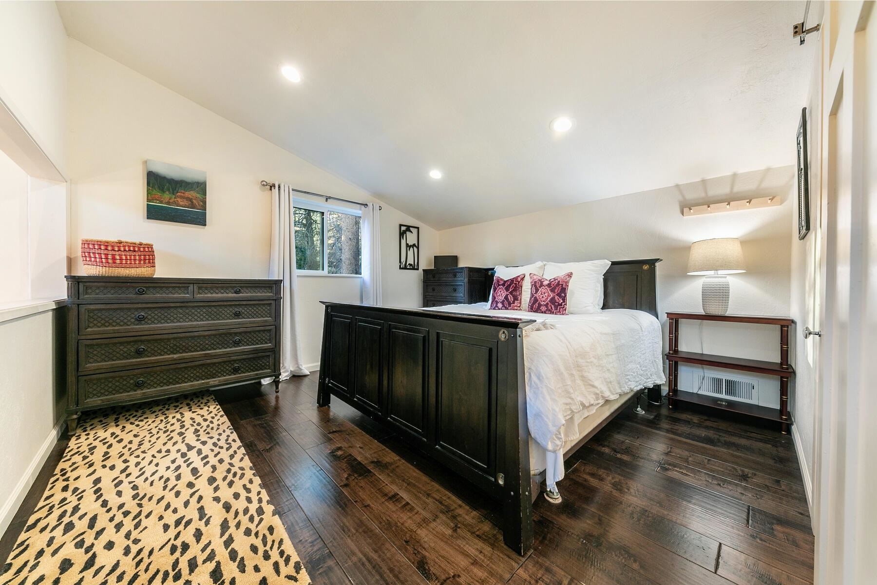 11568 Schussing Way Truckee, CA 96161 - Photo 13 of 28 a bedroom with a bed and wooden floor