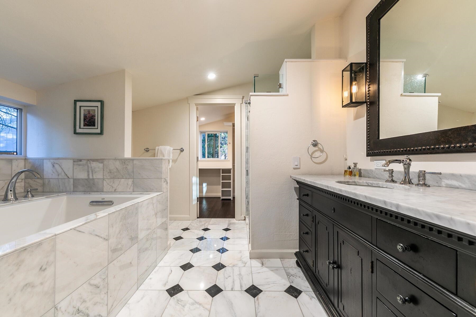 11568 Schussing Way Truckee, CA 96161 - Photo 15 of 28 a bathroom with a bathtub sink and mirror