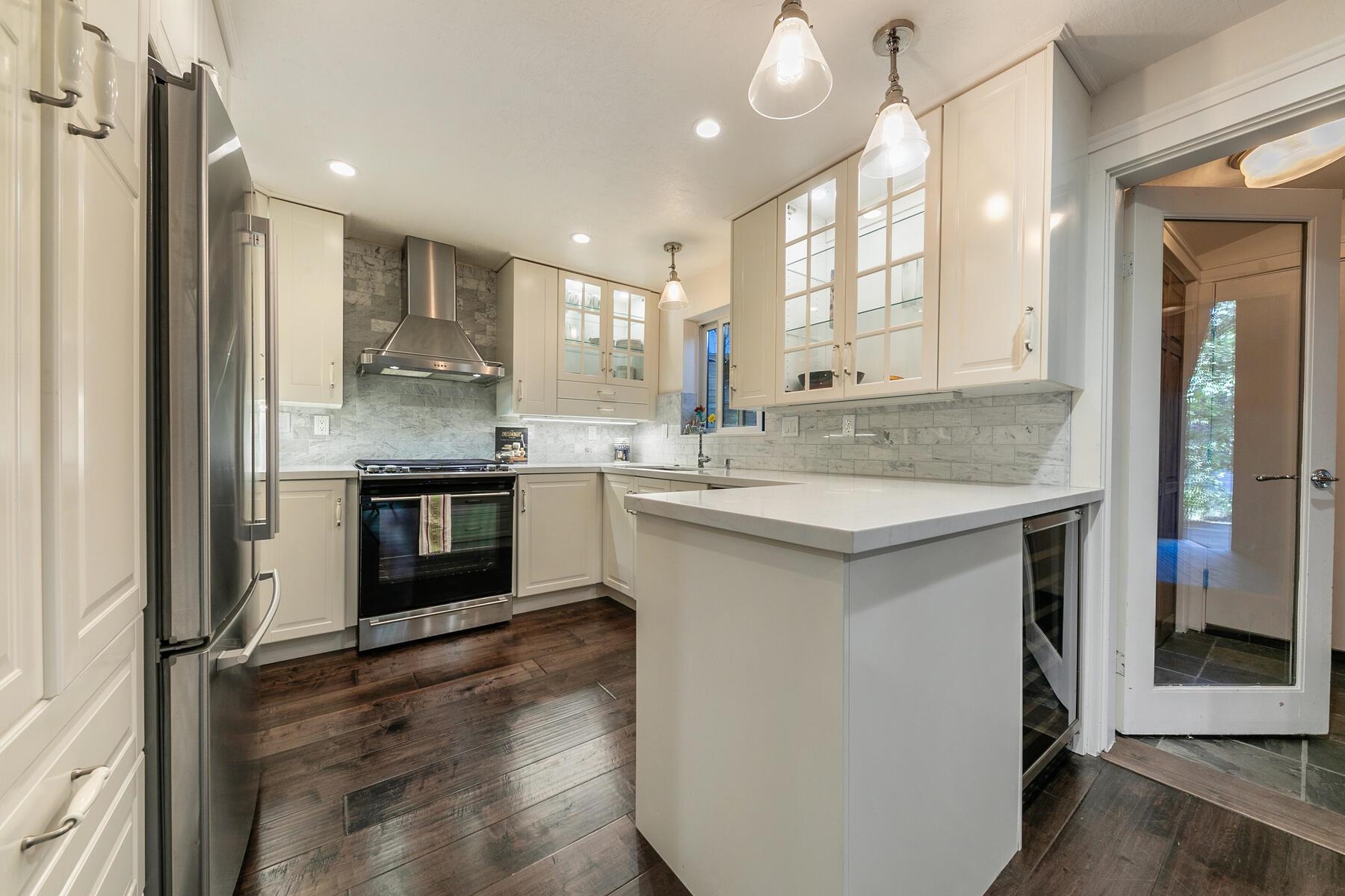 11568 Schussing Way Truckee, CA 96161 - Photo 5 of 28 a kitchen with a sink stove and cabinets