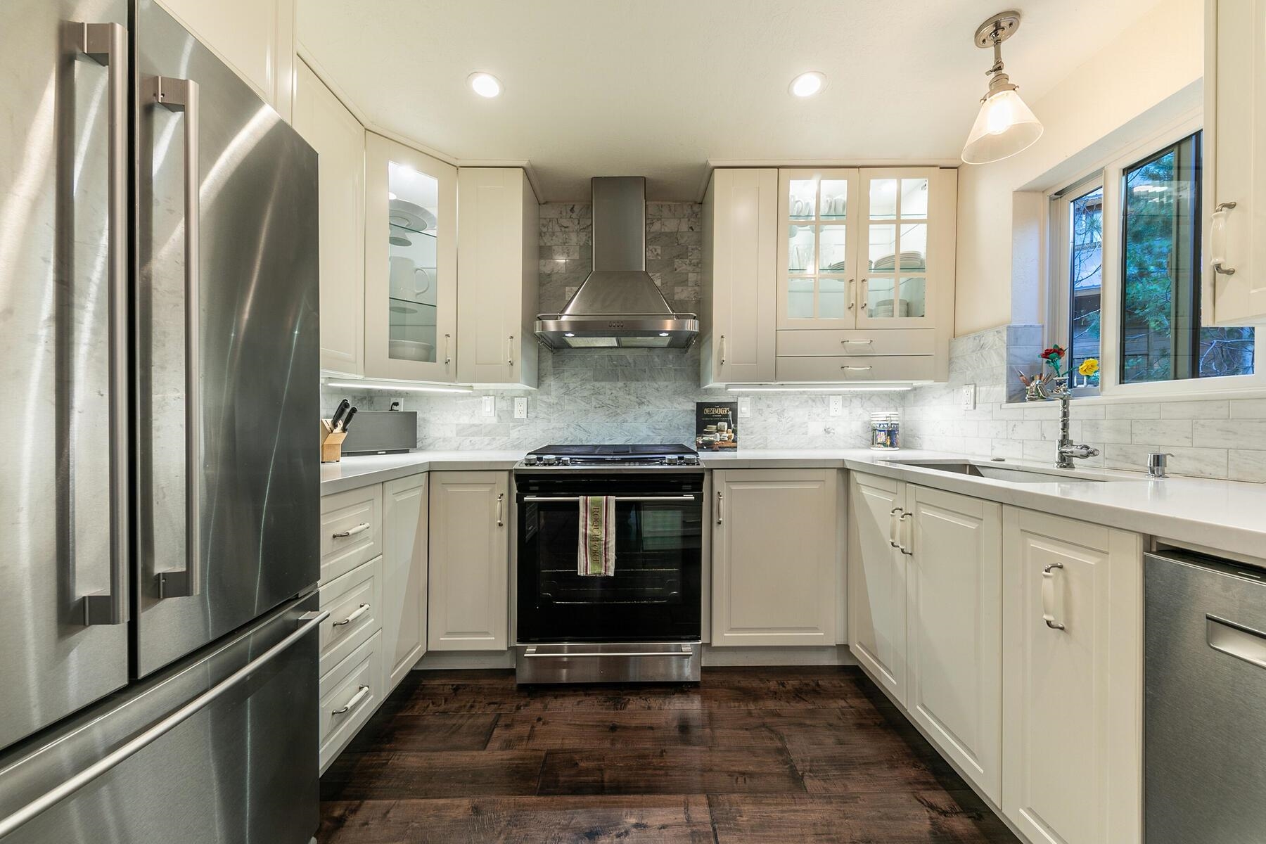 11568 Schussing Way Truckee, CA 96161 - Photo 6 of 28 a kitchen with stainless steel appliances granite countertop a refrigerator and a sink