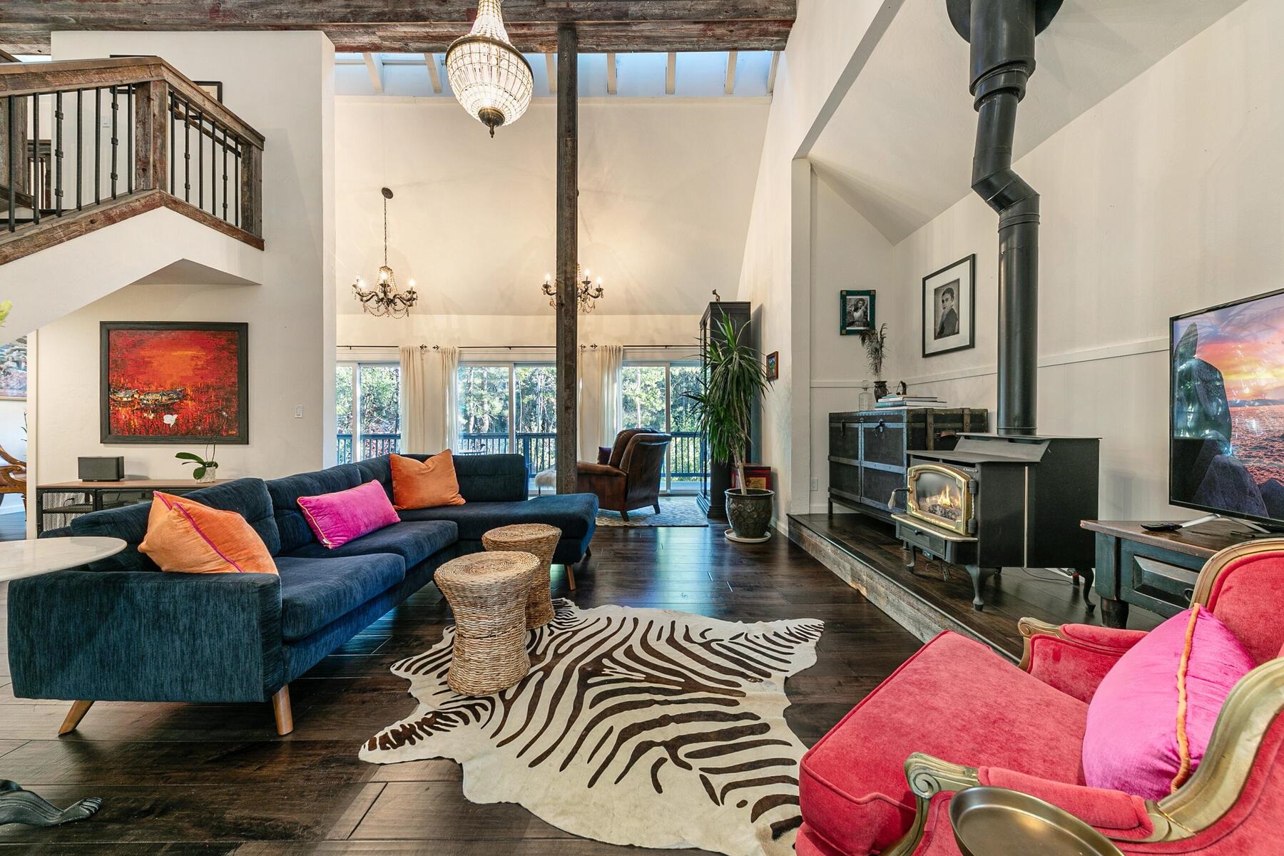 11568 Schussing Way Truckee, CA 96161 - Photo 9 of 28 a living room with furniture a rug and a chandelier