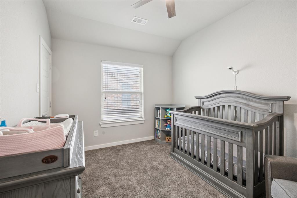 5112 Cathy Drive Forney, TX 75126 - Photo 13 of 32 a view of a bedroom with furniture and windows