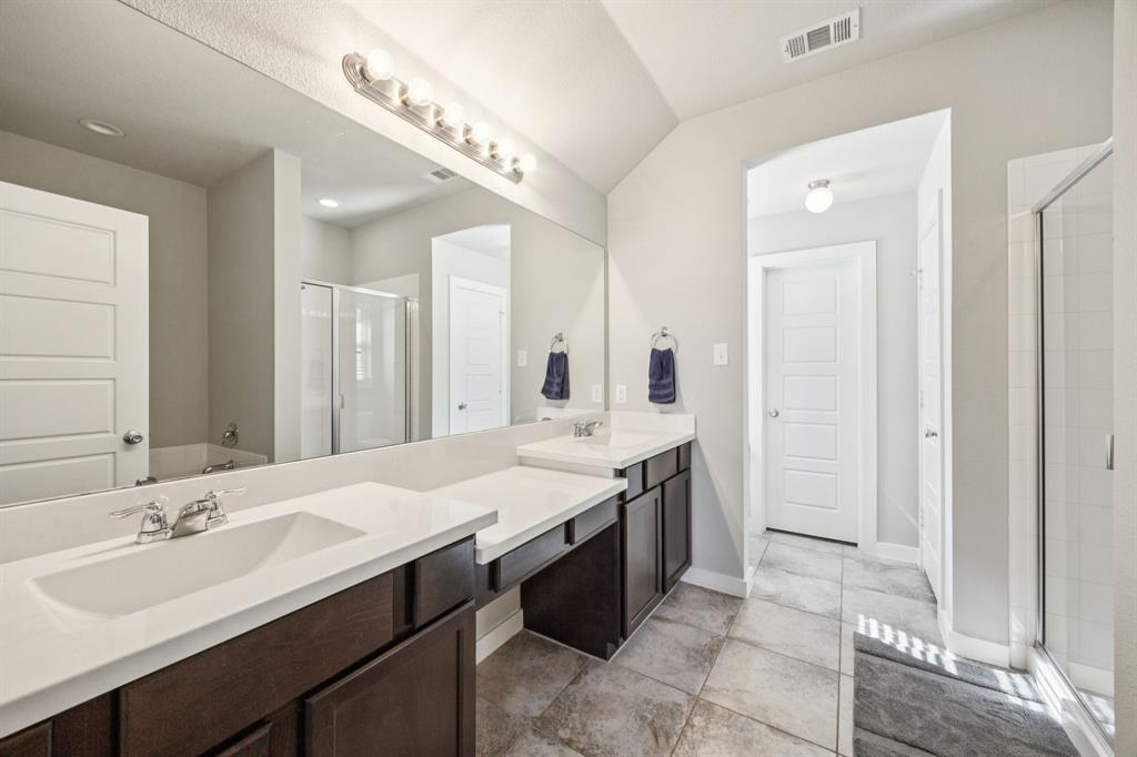 5112 Cathy Drive Forney, TX 75126 - Photo 19 of 32 a spacious bathroom with a double vanity sink a and a mirror
