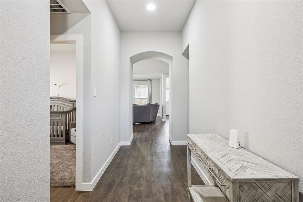 5112 Cathy Drive Forney, TX 75126 - Photo 3 of 32 a view of a bedroom from a hallway