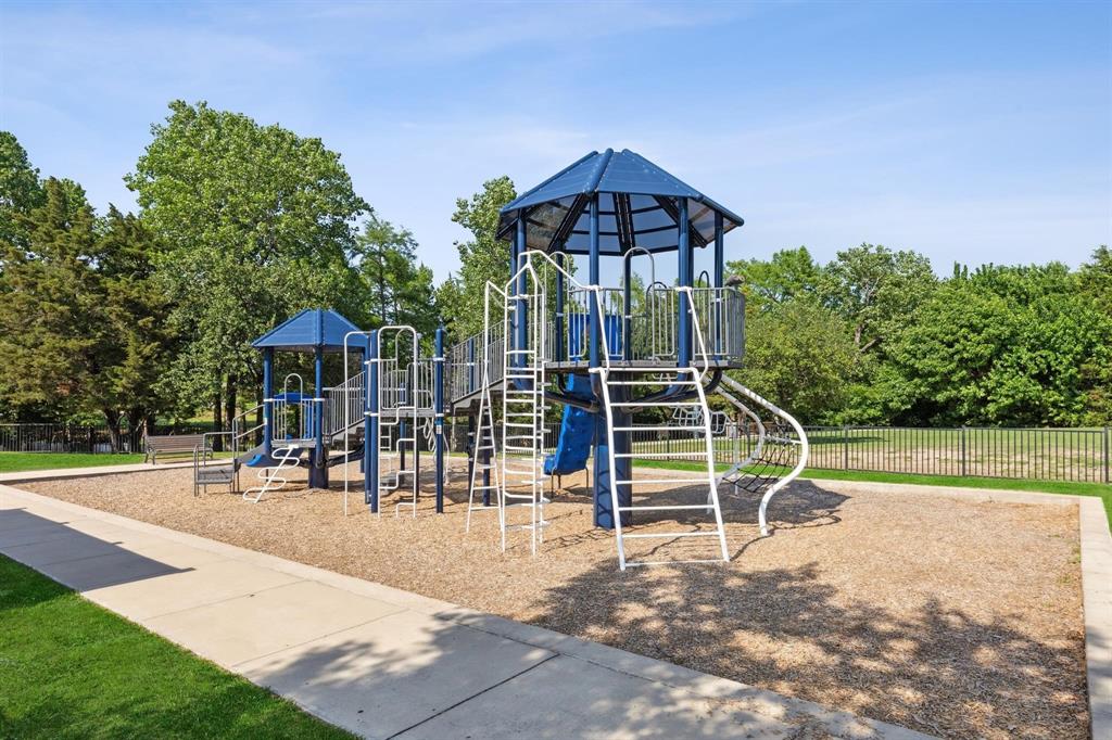 5112 Cathy Drive Forney, TX 75126 - Photo 31 of 32 a view of a yard with a slide