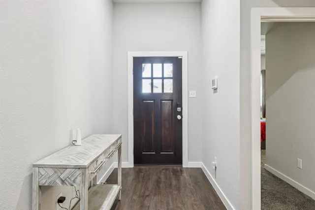 a kitchen with kitchen island granite countertop stainless steel appliances and wooden cabinets