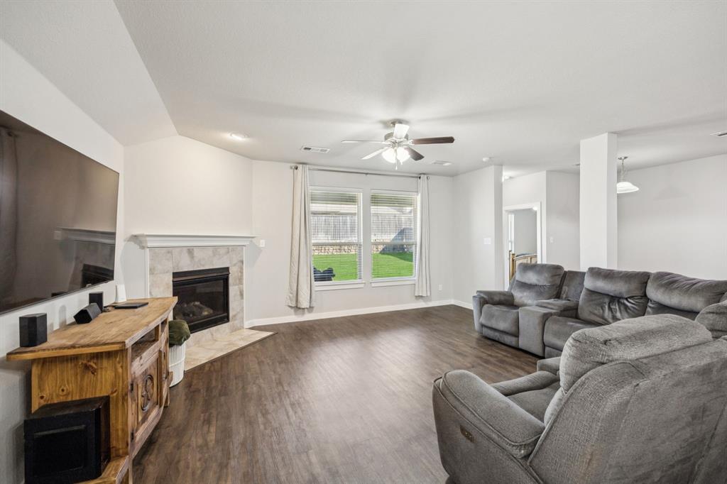 5112 Cathy Drive Forney, TX 75126 - Photo 8 of 32 a living room with furniture fireplace and flat screen tv