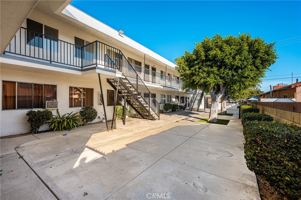 6725 Perry Road Bell Gardens, CA 90201 - Photo 7 of 40 a view of a building with a street
