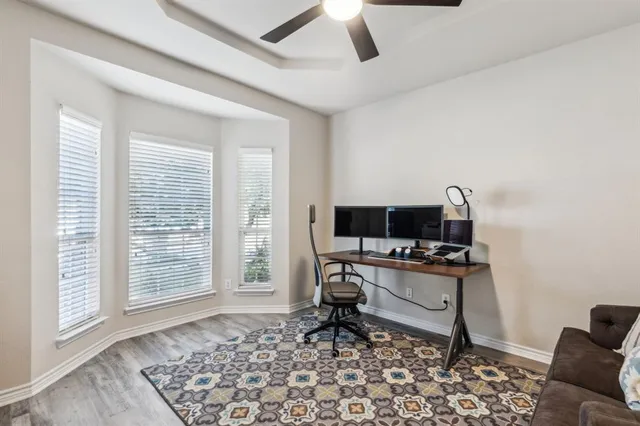 a workspace with furniture and a window