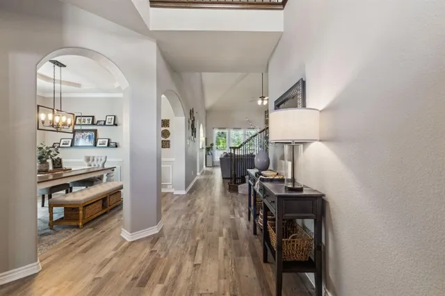 a view of a workspace room with wooden floor