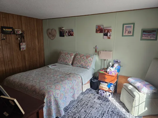 a bedroom with a bed and furniture