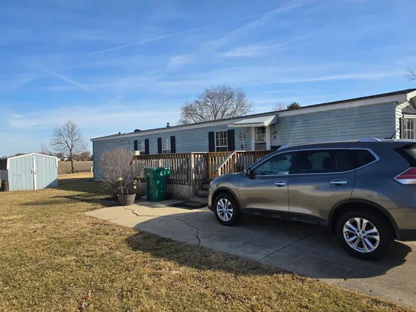 a view of a car parked in front of a house