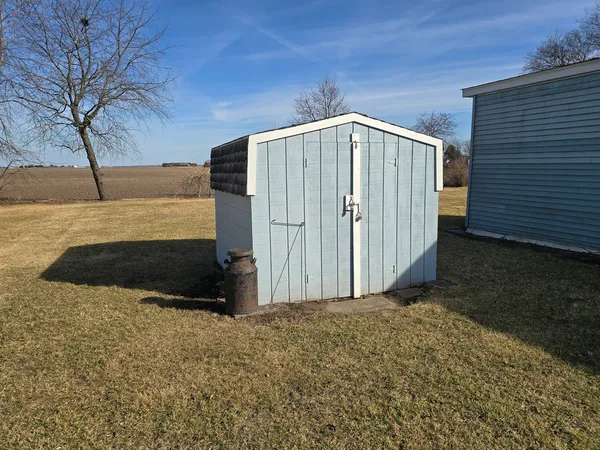 a view of backyard with large trees