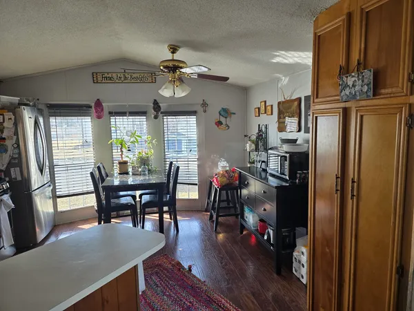 a view of a dining room with furniture window and outside view