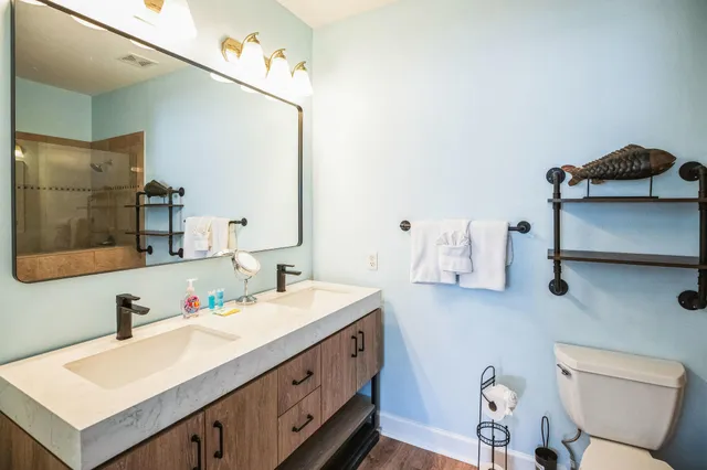 a bathroom with a sink vanity and mirror