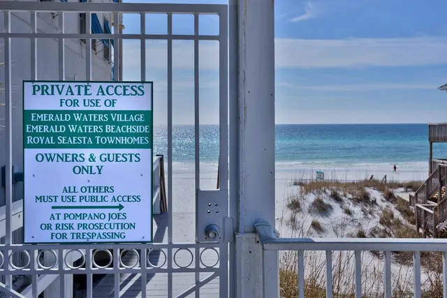 a balcony with outdoor seating and wooden floor