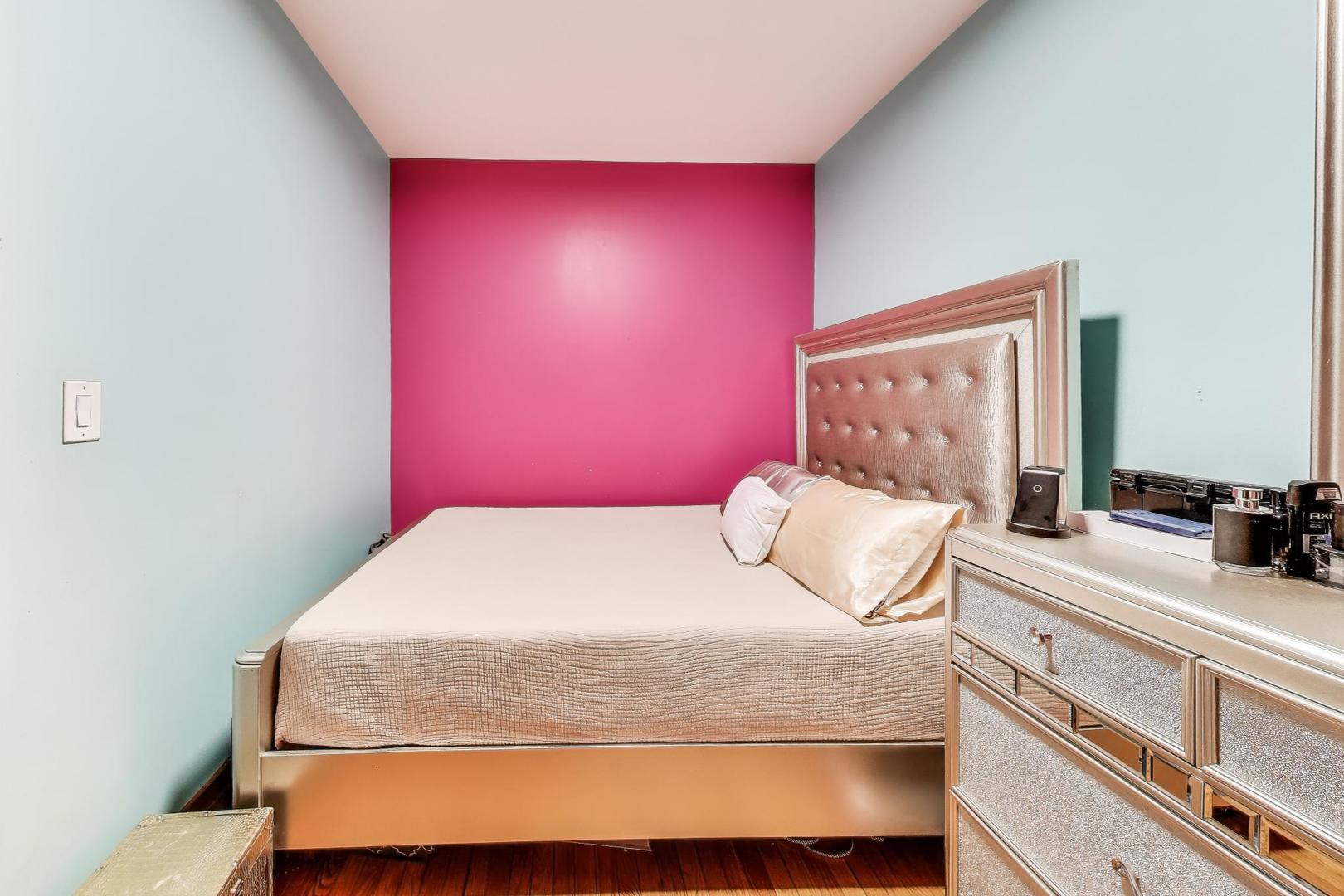 6432 South Kilpatrick Avenue Chicago, IL 60629 - Photo 12 of 36 a bedroom with a bed and a dresser