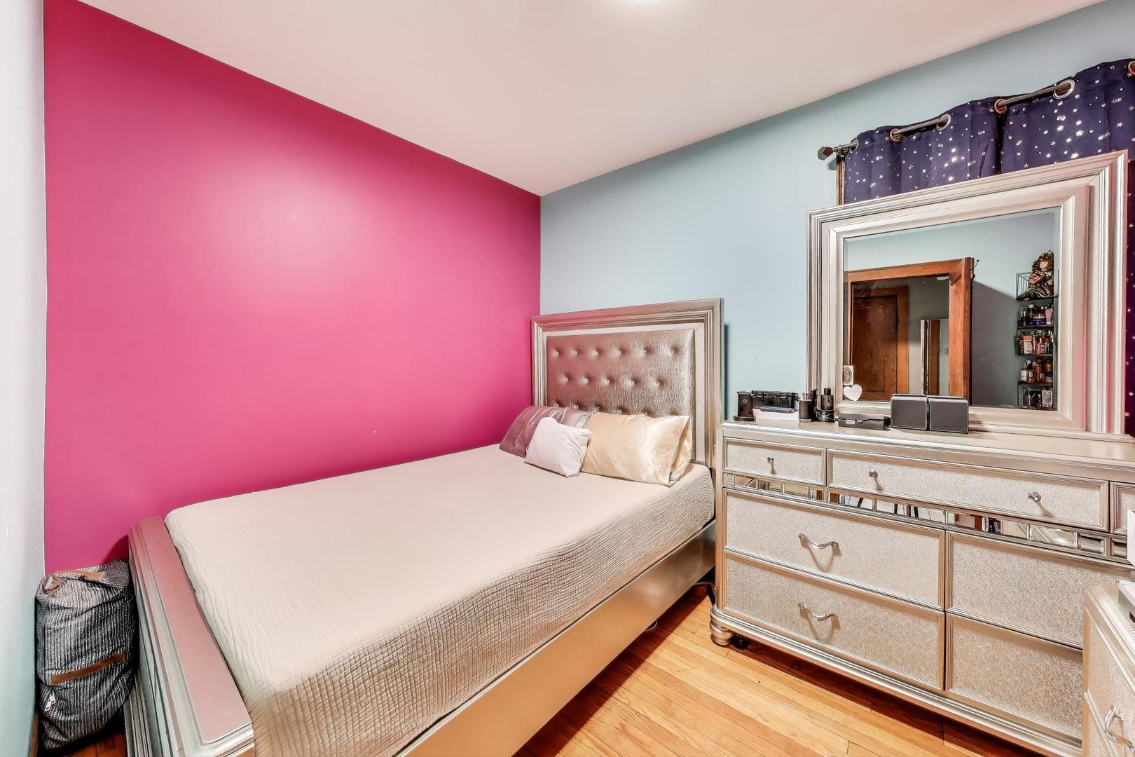 6432 South Kilpatrick Avenue Chicago, IL 60629 - Photo 13 of 36 a bedroom with a bed and a dresser