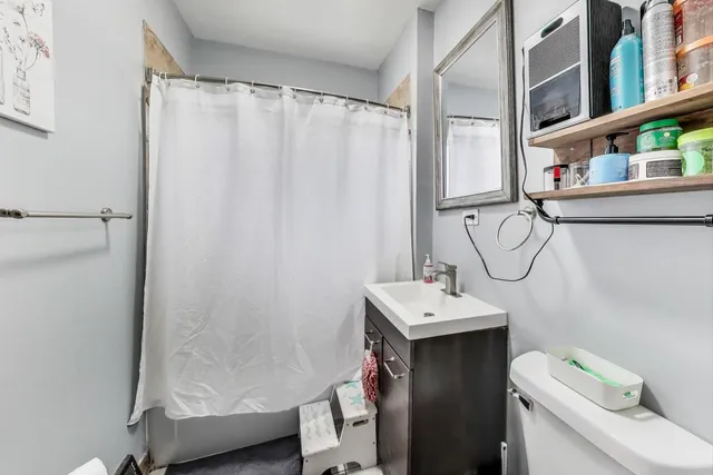 a bedroom with bed or furniture and a flat screen tv