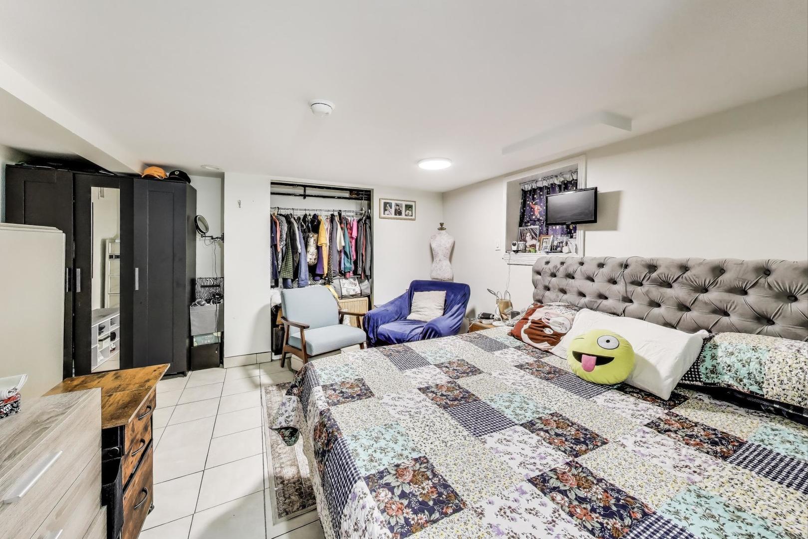 6432 South Kilpatrick Avenue Chicago, IL 60629 - Photo 16 of 36 a bedroom with a bed and wooden floor