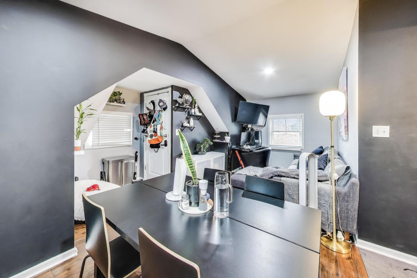 6432 South Kilpatrick Avenue Chicago, IL 60629 - Photo 23 of 36 a living room with furniture and a chandelier