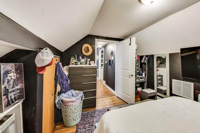 a bathroom with a sink mirror and toilet