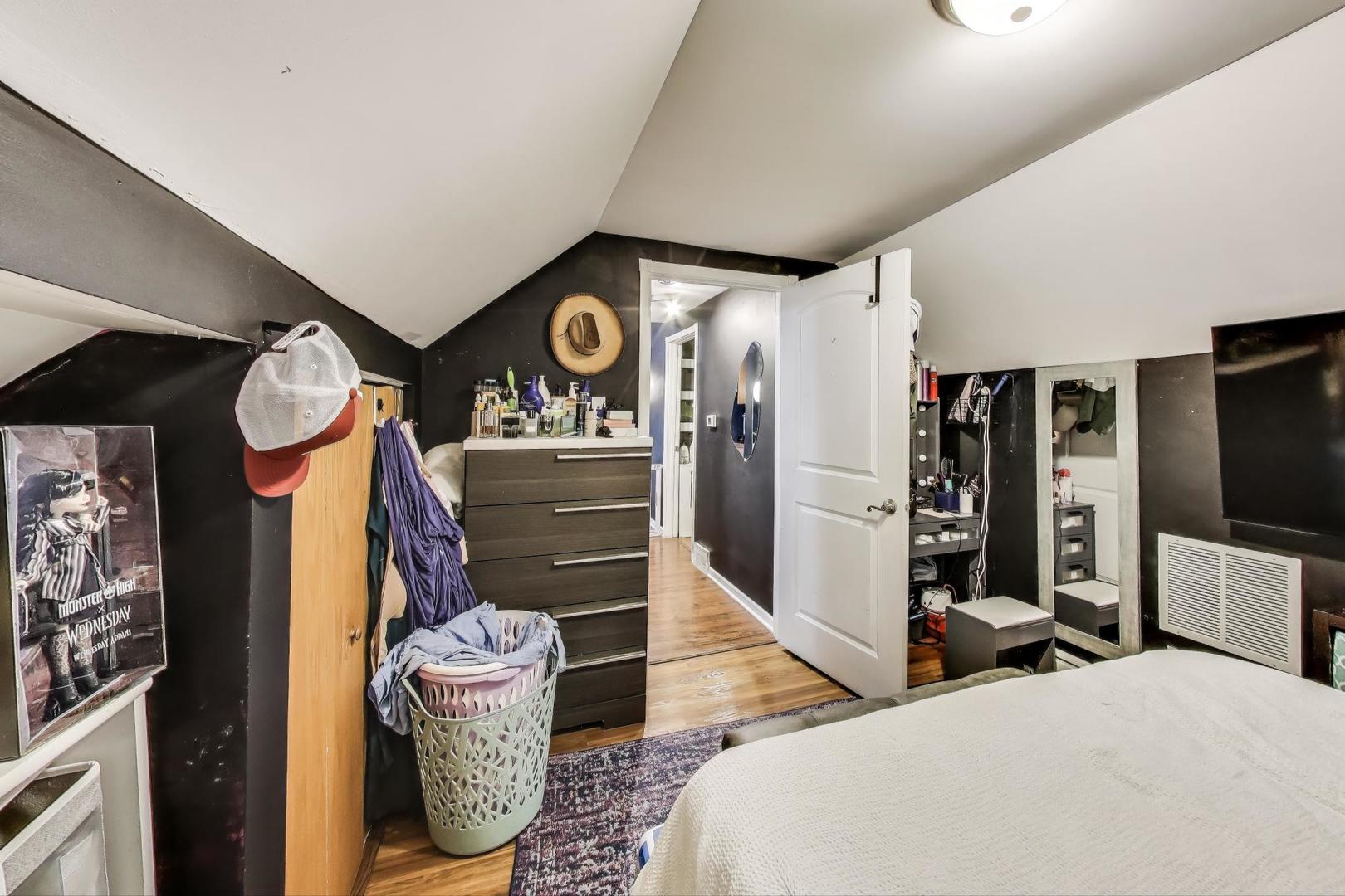 6432 South Kilpatrick Avenue Chicago, IL 60629 - Photo 26 of 36 a living room with furniture and a flat screen tv