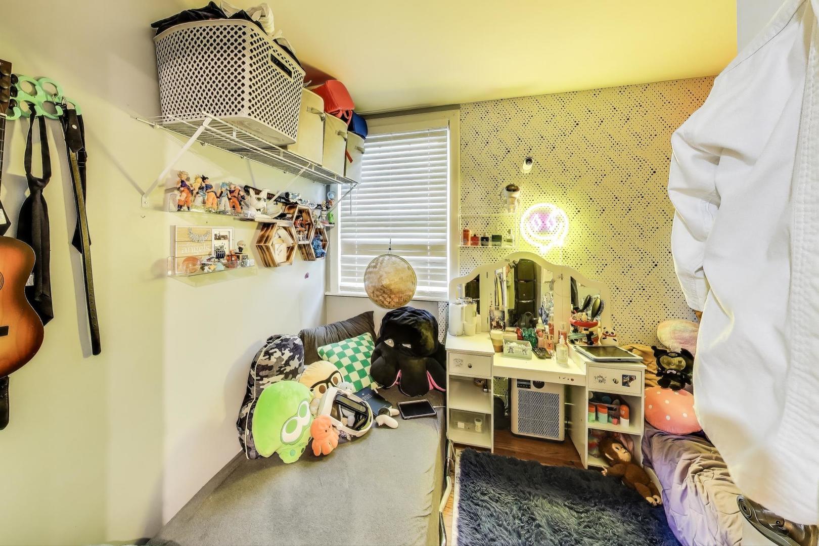 6432 South Kilpatrick Avenue Chicago, IL 60629 - Photo 27 of 36 a bedroom with a bed and wooden floor