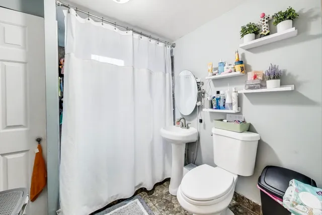a utility room with sink dryer and washer