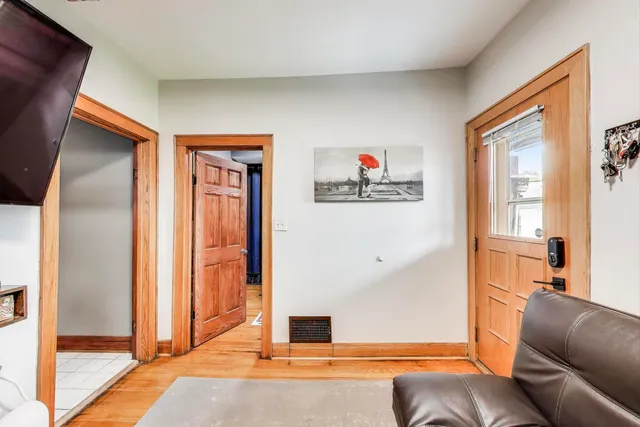 a view of a large building with a yard and sitting area