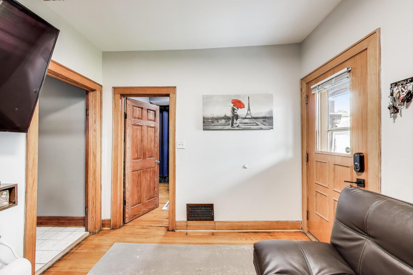 6432 South Kilpatrick Avenue Chicago, IL 60629 - Photo 30 of 36 a living room with furniture and a window