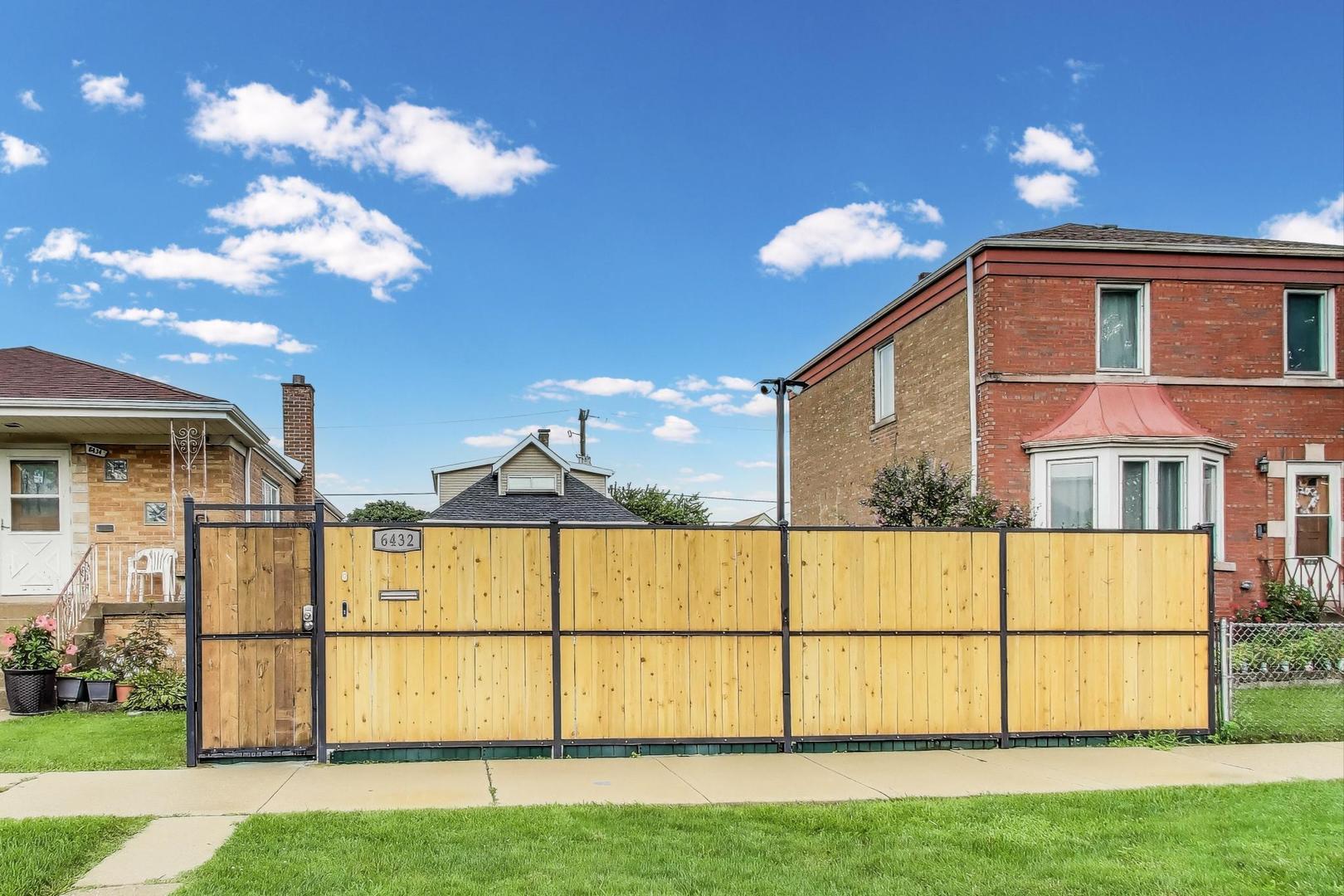 6432 South Kilpatrick Avenue Chicago, IL 60629 - Photo 32 of 36 a view of a large building with a yard and sitting area
