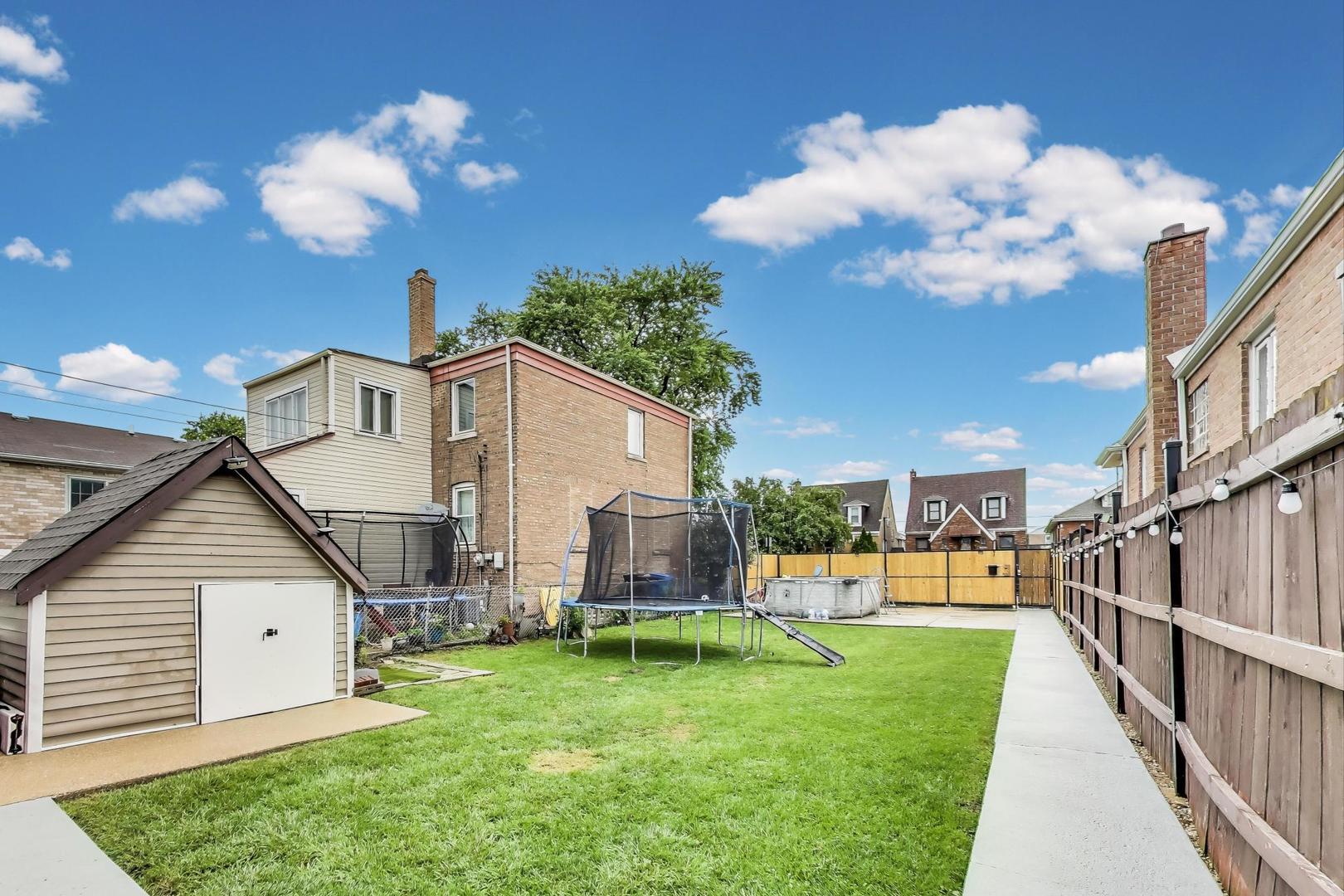 6432 South Kilpatrick Avenue Chicago, IL 60629 - Photo 34 of 36 a view of a house with backyard