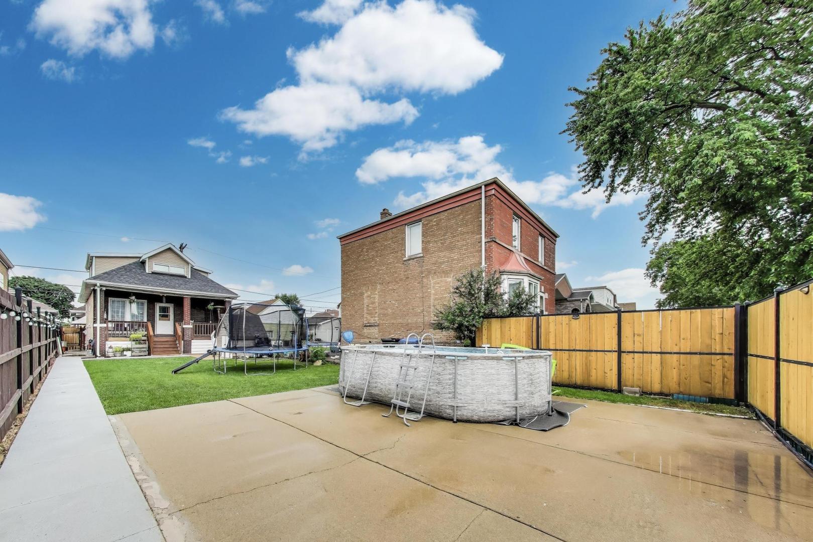 6432 South Kilpatrick Avenue Chicago, IL 60629 - Photo 35 of 36 a view of house with yard