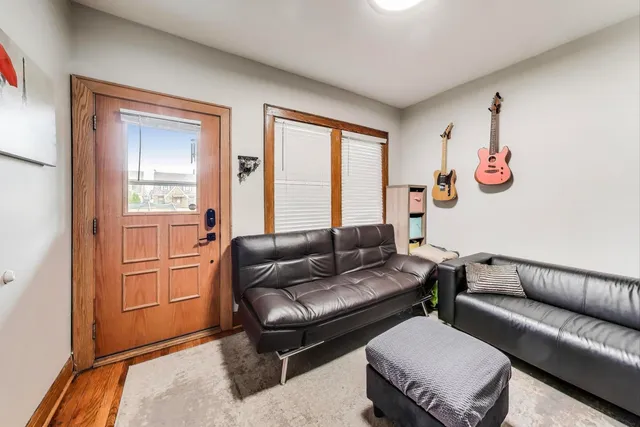 a kitchen with stainless steel appliances kitchen island granite countertop a refrigerator and a stove top oven