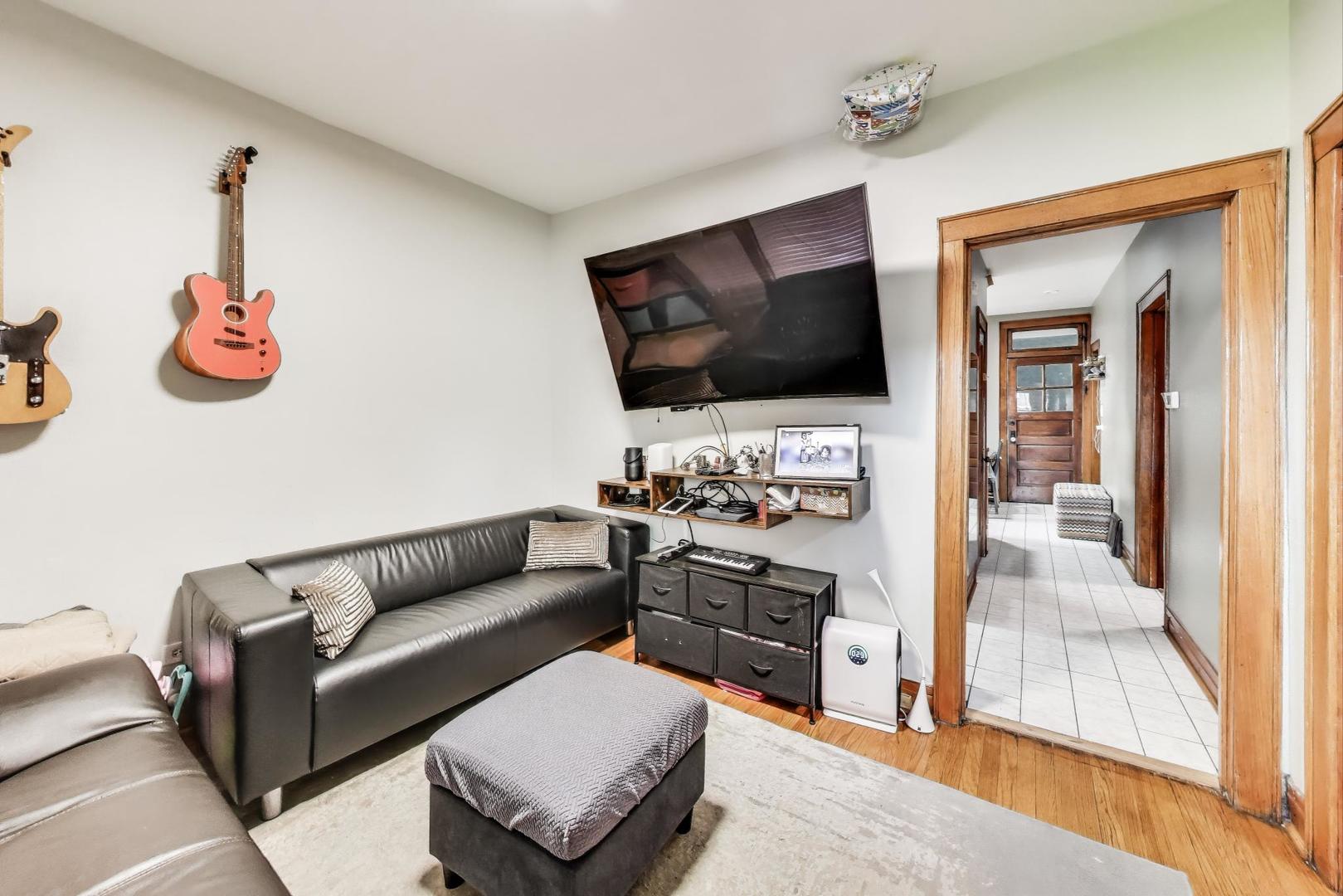 6432 South Kilpatrick Avenue Chicago, IL 60629 - Photo 7 of 36 a living room with furniture and a flat screen tv