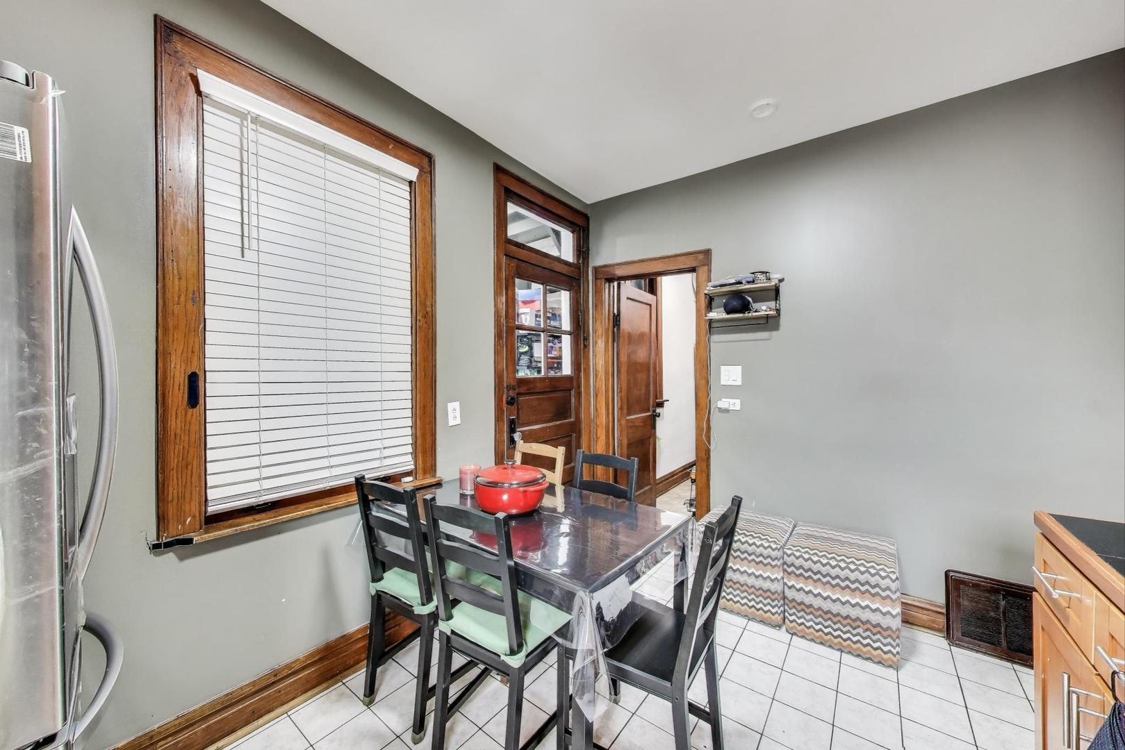 6432 South Kilpatrick Avenue Chicago, IL 60629 - Photo 10 of 36 a view of a dining room with furniture and window