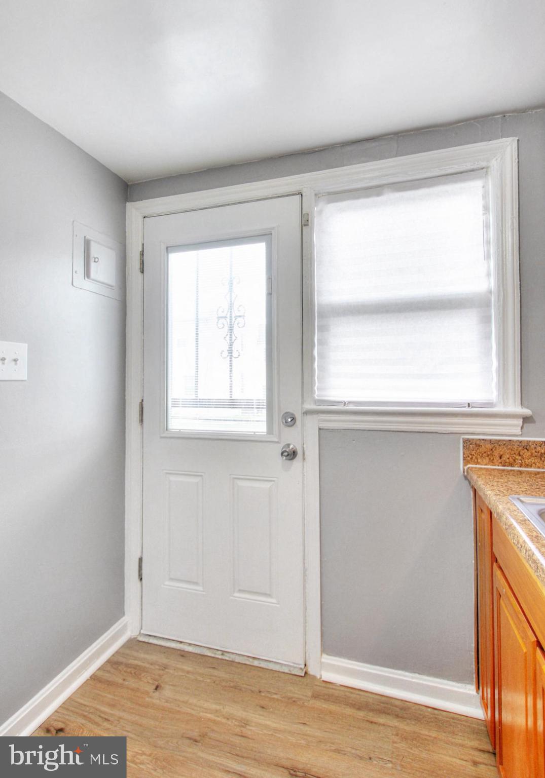2580 Iverson Street Temple Hills, MD 20748 - Photo 13 of 19 a view of an empty room with wooden floor and a window