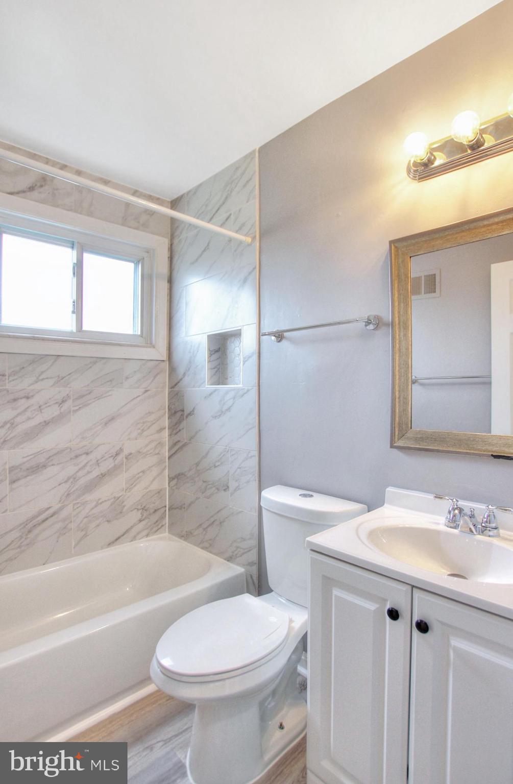 2580 Iverson Street Temple Hills, MD 20748 - Photo 17 of 19 a bathroom with a sink toilet and shower