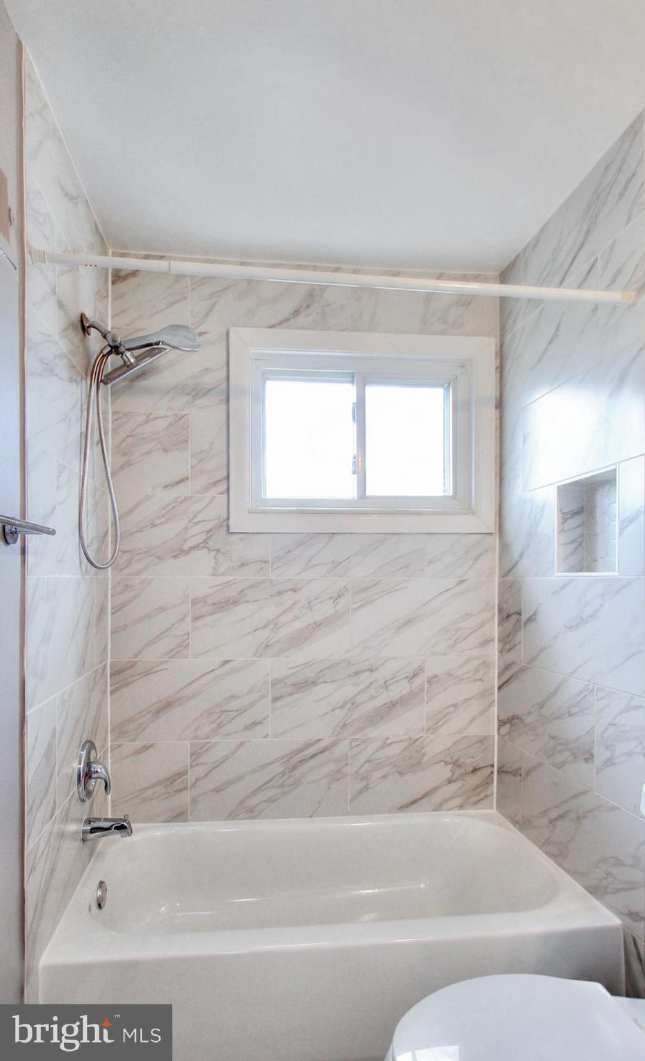 2580 Iverson Street Temple Hills, MD 20748 - Photo 18 of 19 a bathroom with a bathtub and a shower