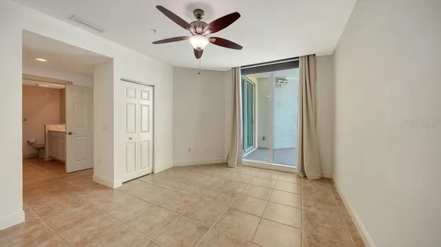 a living room with lots of furniture and painting on the wall