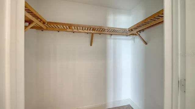 a view of a hallway with seating area