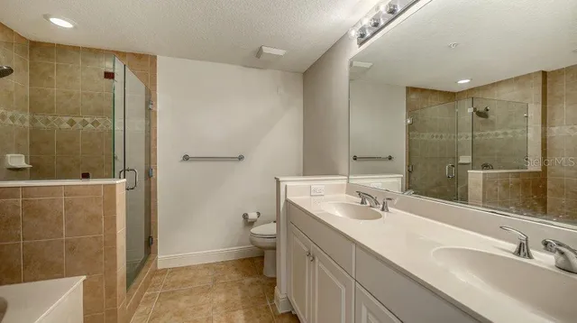 a room with pool table and windows