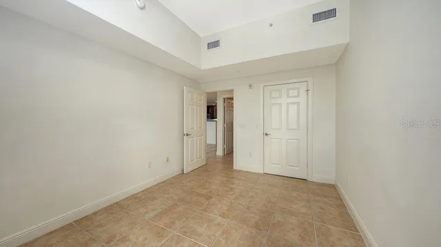 a view of a street with a tree