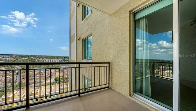 a kitchen with stainless steel appliances granite countertop a stove microwave and refrigerator