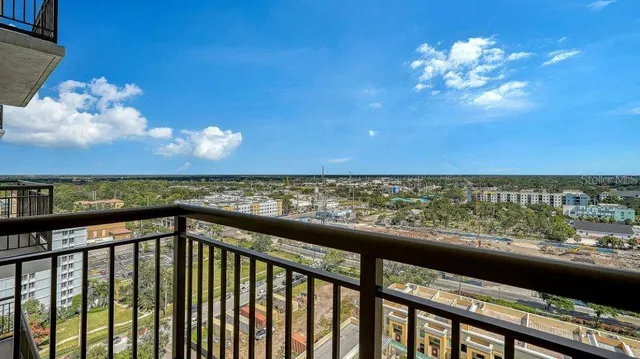 an empty room with closet and windows